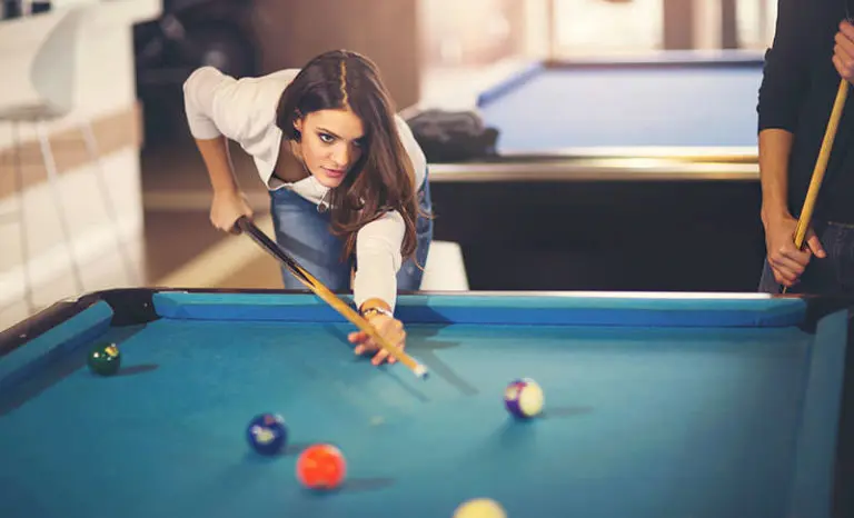 woman playing pool